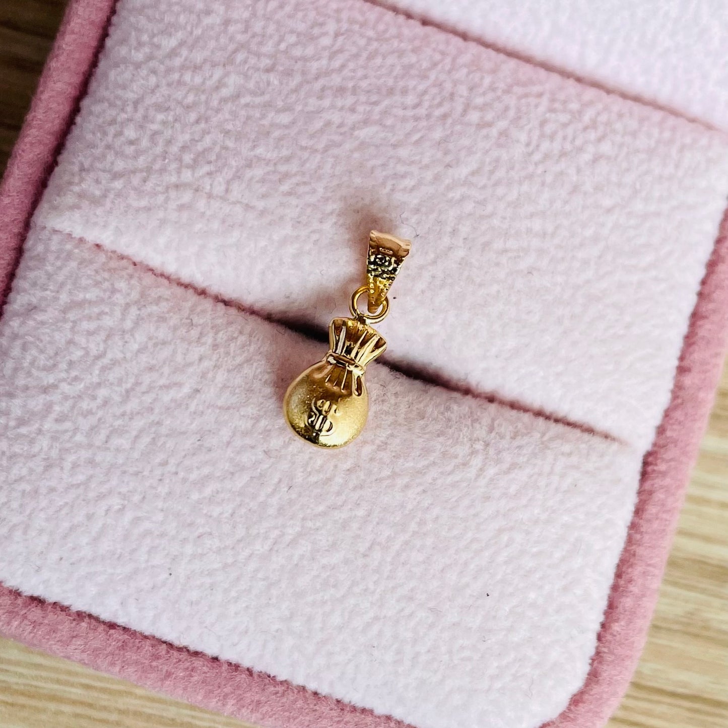 DIJE BOLSA DE DINERO 1,5CM ORO AMARILLO COL 18K - 0,28GR (NG)