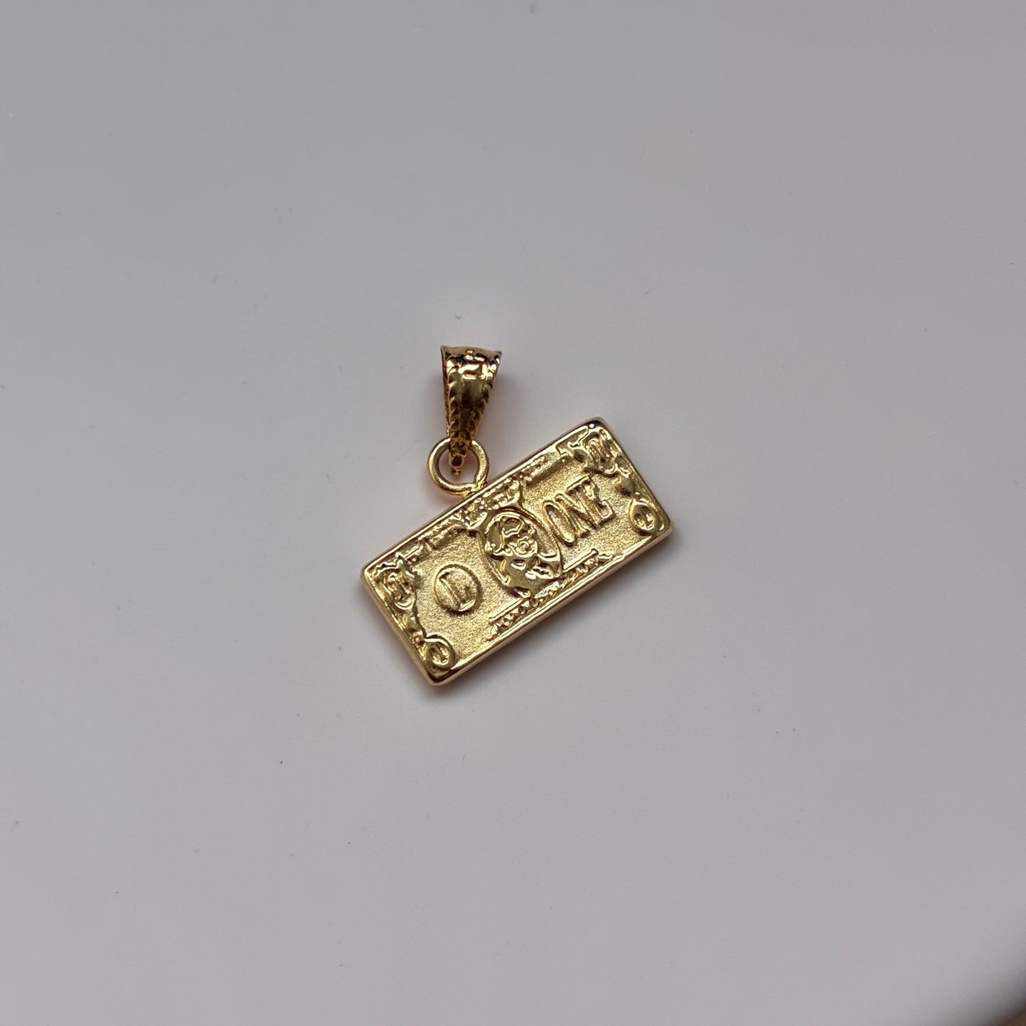 DIJE BILLETE DE DOLAR 0.6CM ORO AMARILLO 18K -  0,6GR