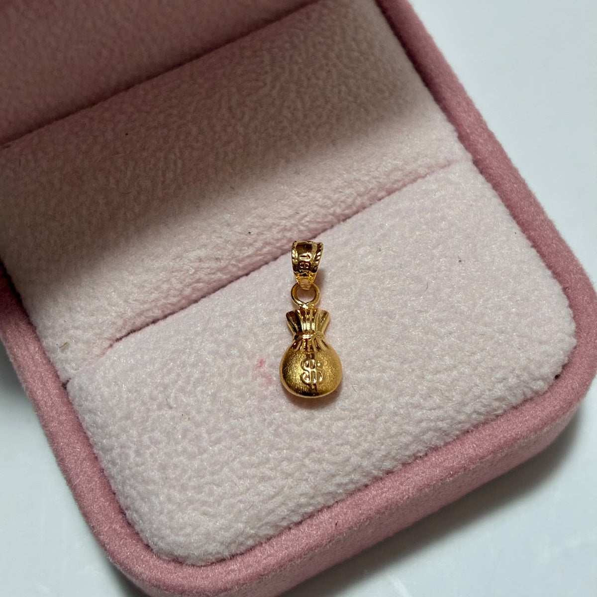 DIJE BOLSA DE DINERO 1.5CM ORO AMARILLO COL 18K-0.29GR