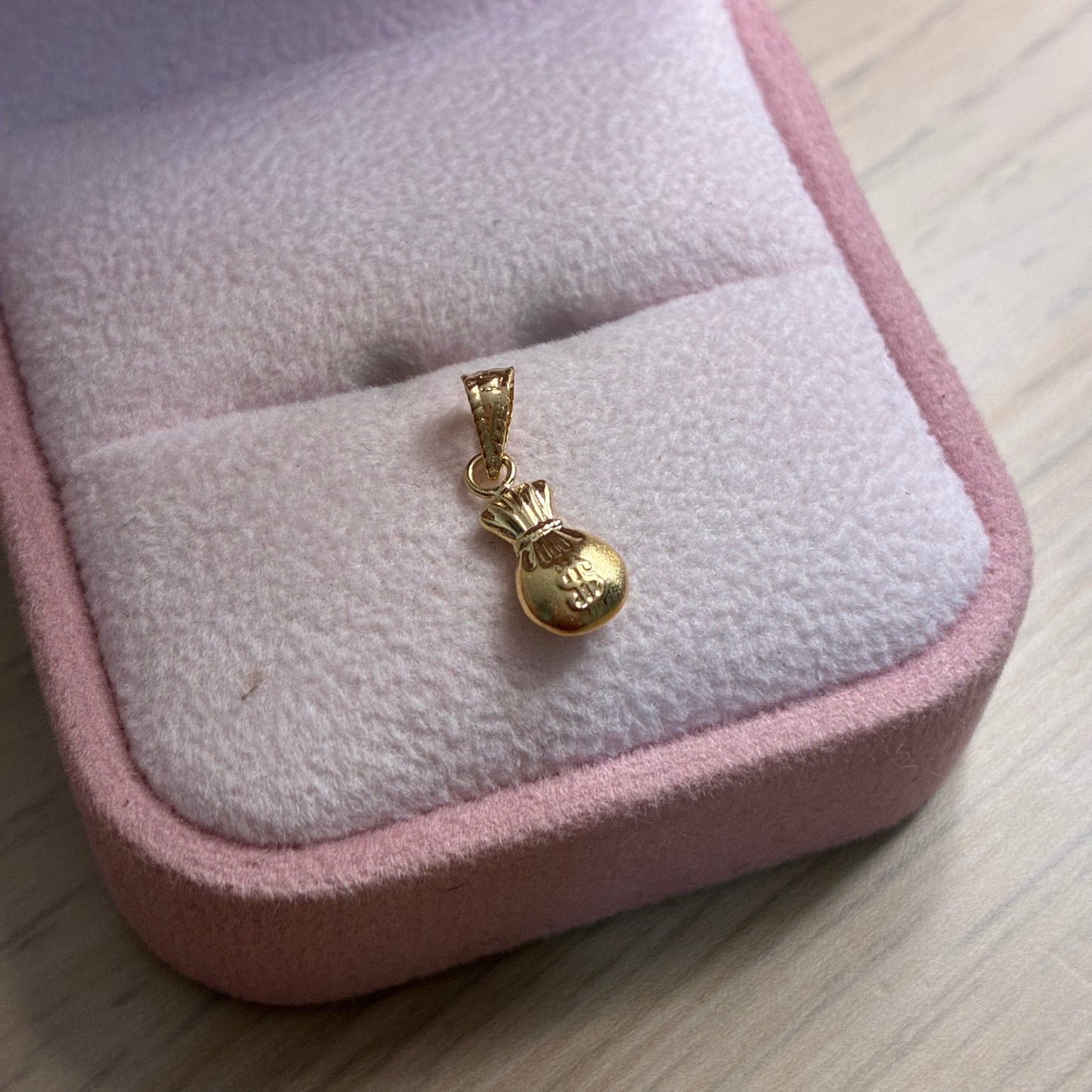 DIJE BOLSA DE DINERO LISA 1,2CM ORO AMARILLO COL 18K - 0,29GR